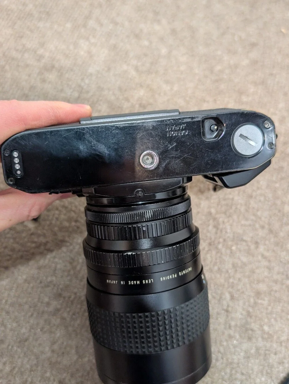 Vintage Canon A-1 Black SLR Camera with Black Lens and Black Flash